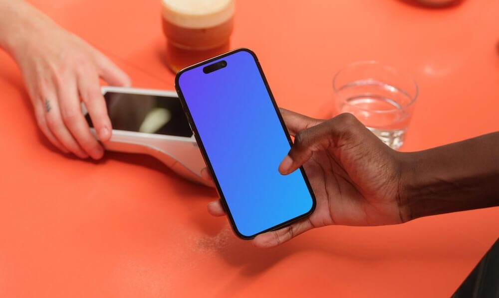 Woman paying with iPhone mockup
