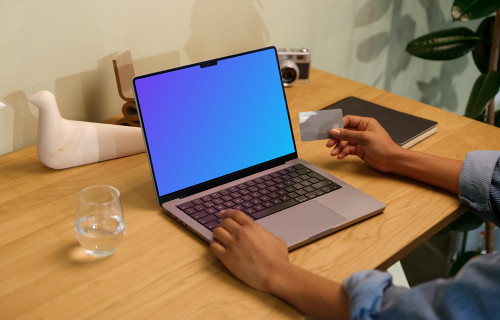 Hand typing on a MacBook Pro mockup
