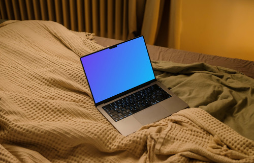 MacBook mockup em lençóis de cama