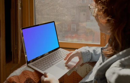 Woman working on laptop mockup