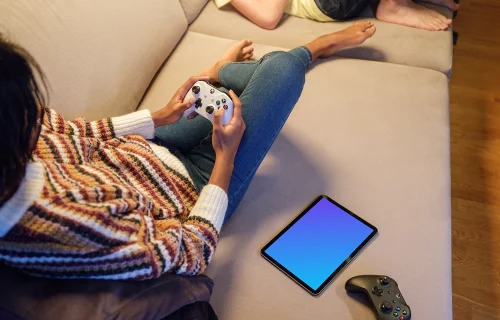 iPad Air mockup with gaming controllers on a sofa