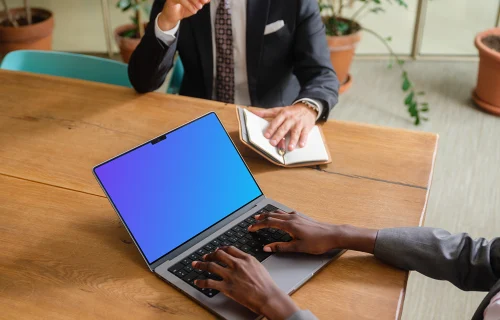 MacBook Pro 14 mockup in the business meeting