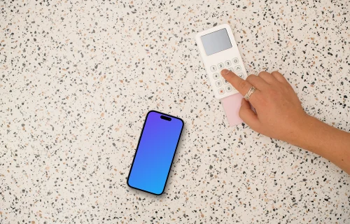 Person paying next to the iPhone mockup