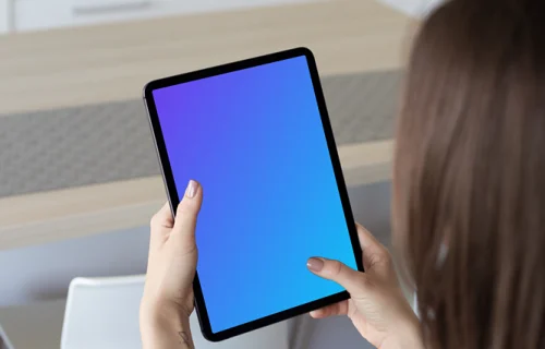 Tablet mockup held by lady in a kitchen