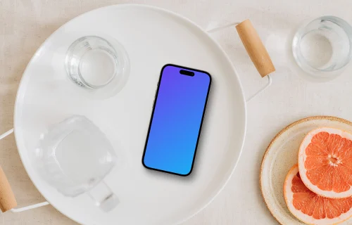 Minimalist table setting with an iPhone mockup