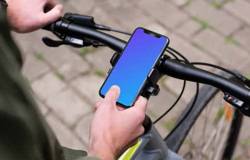 Sentado na bicicleta tocando o iPhone 11 Pro mockup na montagem da bicicleta