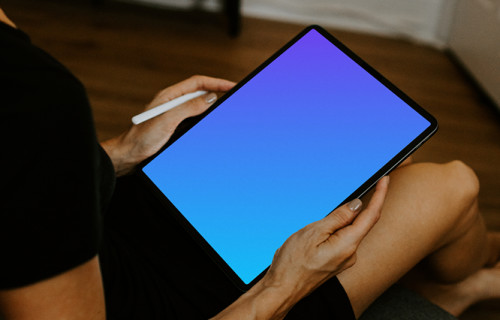 Tablet mockup held with an Apple Pencil